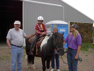 cody_on_savali_with_volunteers.jpg